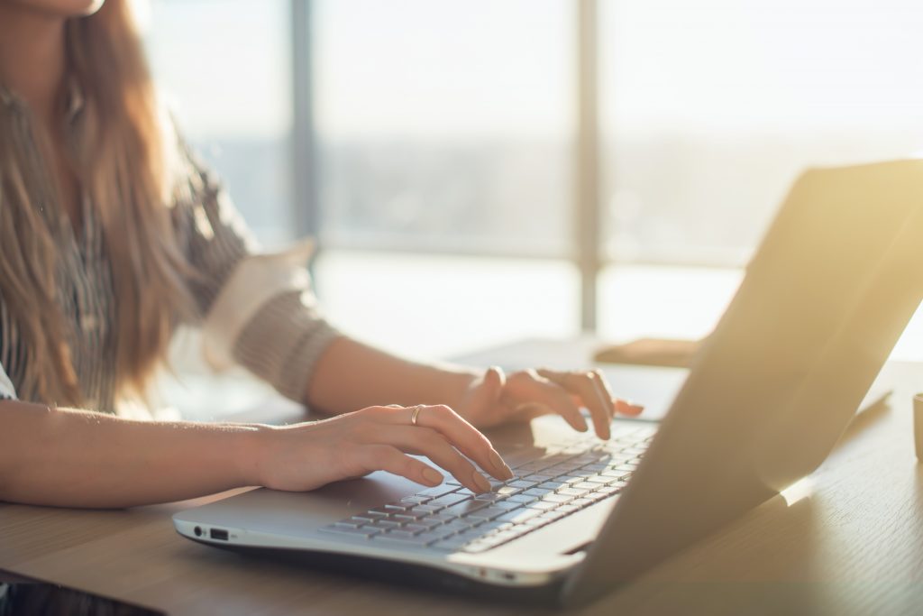 Woman attending webinar on achieving card program goals